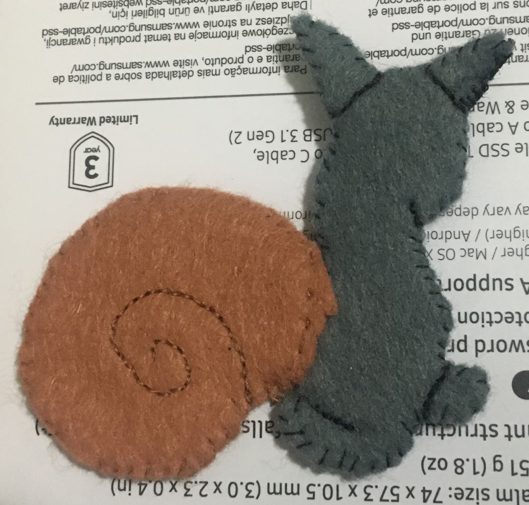 Medieval cat-snail made from felt